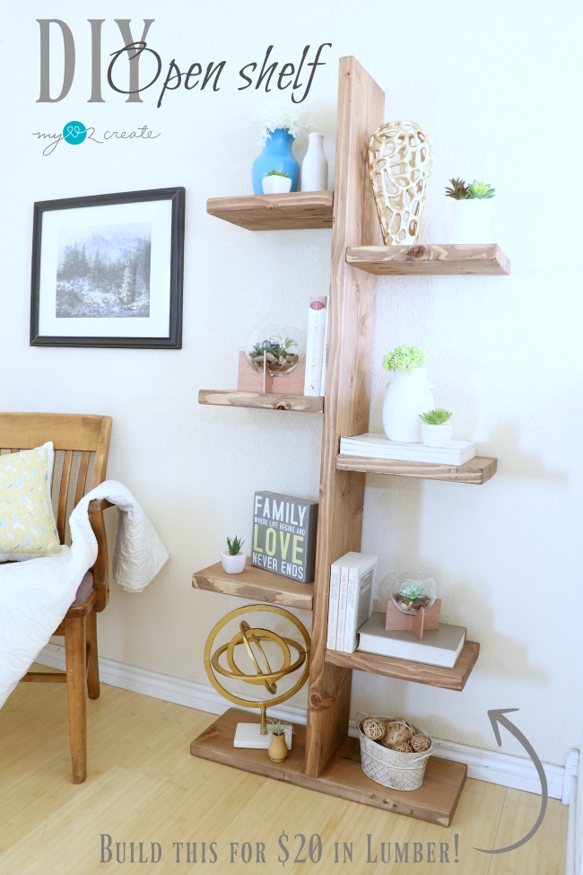 DIY Open Shelf made from wood, featuring staggered shelves with decorative items like books, plants, and vases. Positioned in a cozy corner with a wooden chair and framed wall art.