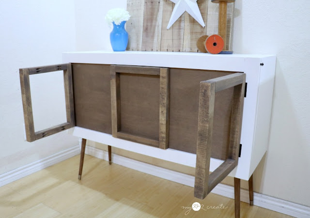 credenza with frames that swing out as legs for a hidden kids pull down table